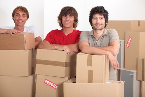 Team of movers handling furniture during a relocation.